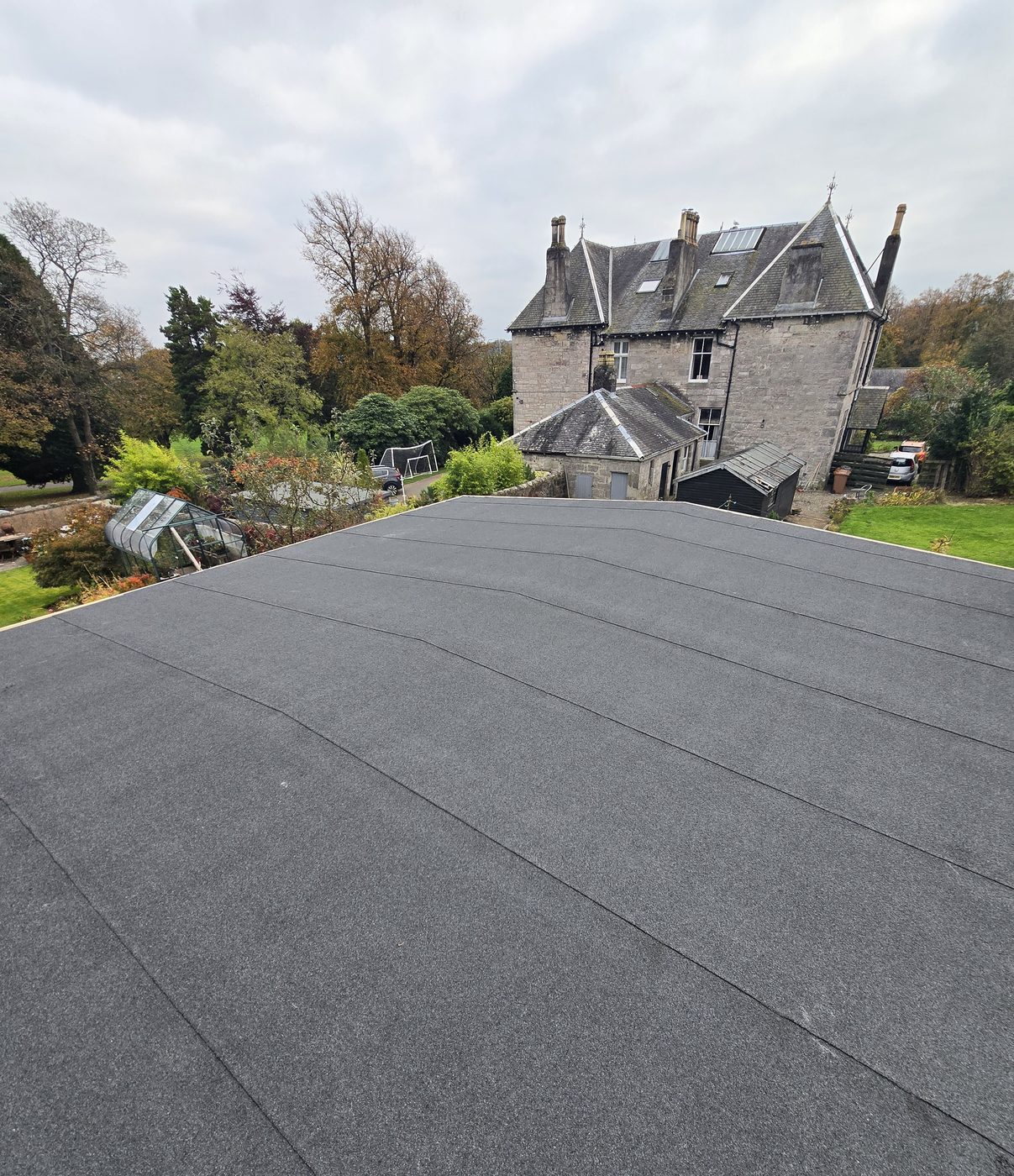 Completed flat roof on a stone villa in Fife by Thistle Roofing and Building