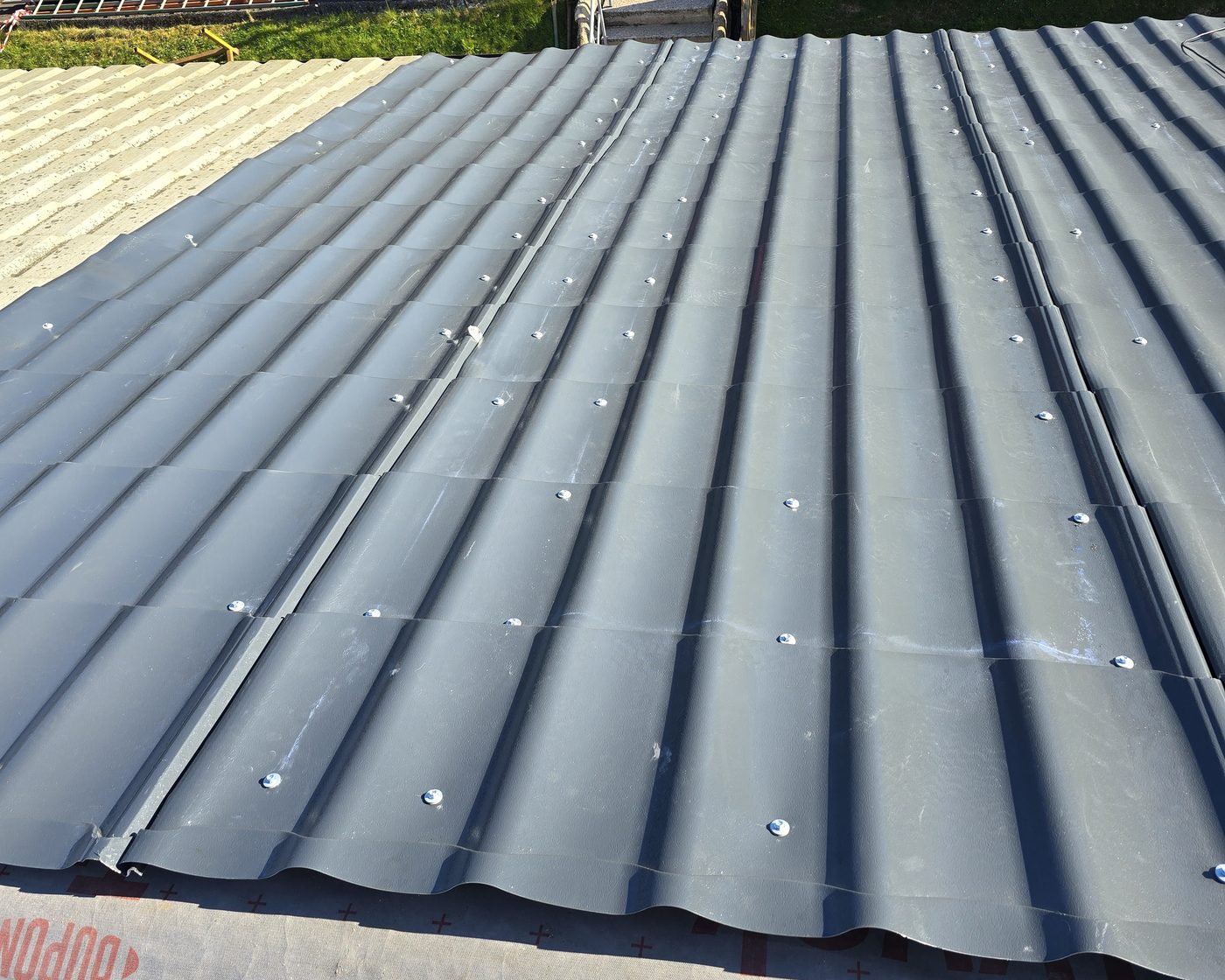 Storm-damaged roof replaced with tile-effect sheets in Dumbarton