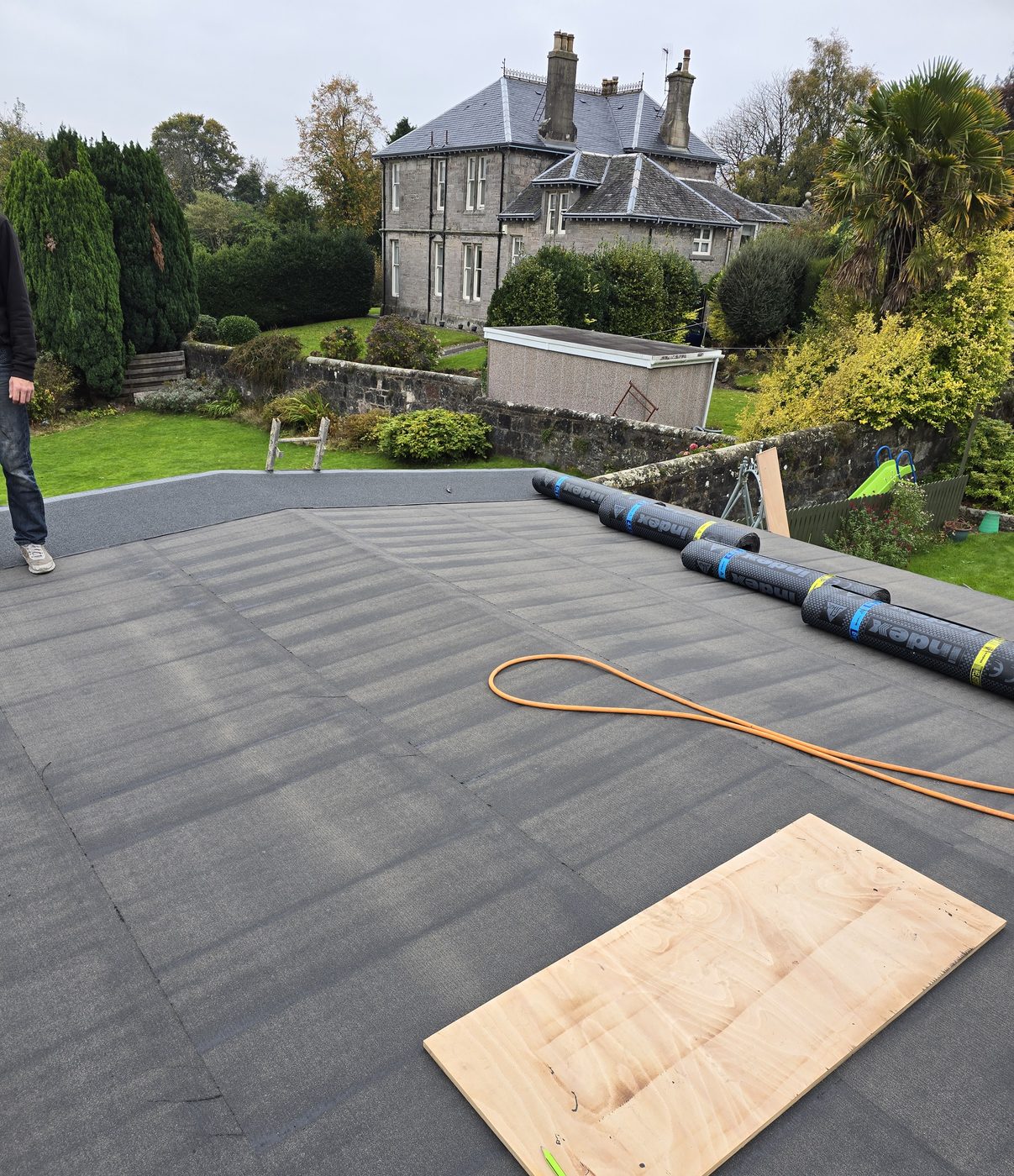 Thistle Roofing and Building laying a new flat roof
